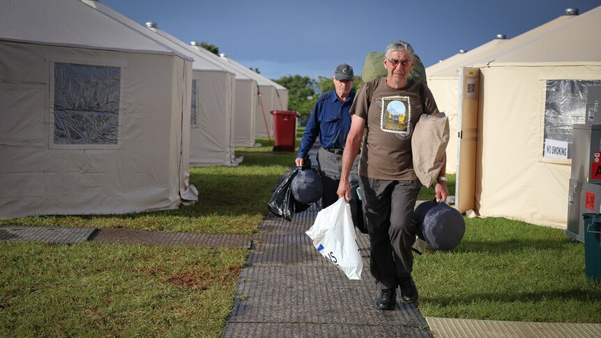 Robert Colgan-Gore from Booral Rural Fire Service with suitcase