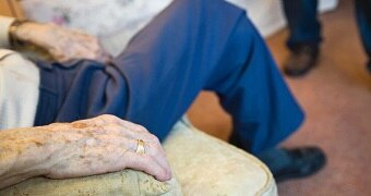 Close up of elderly man's hand in nursing home.