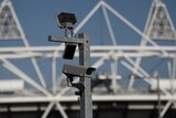 A security cctv camera is seen by the Olympic Stadium at the Olympic Park in London.