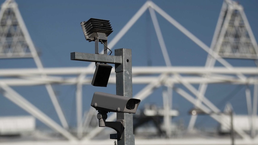 A security cctv camera is seen by the Olympic Stadium at the Olympic Park in London.