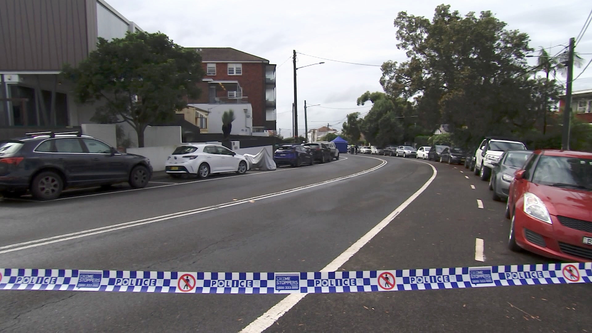 A street cordoned off with police tape where an alleged hit and run took place.