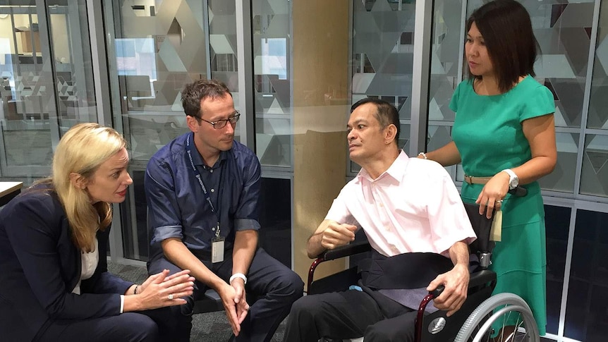 Medical specialists at Brisbane's Mater Hospital speak to Gerhard and Leah Infante.