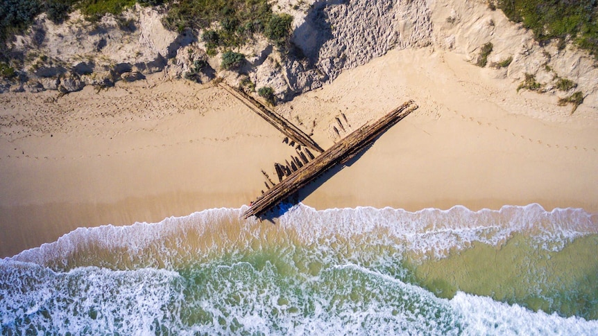 Shipwreck washed up on beach