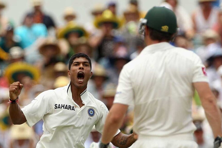 Yadav celebrates the wicket of Marsh