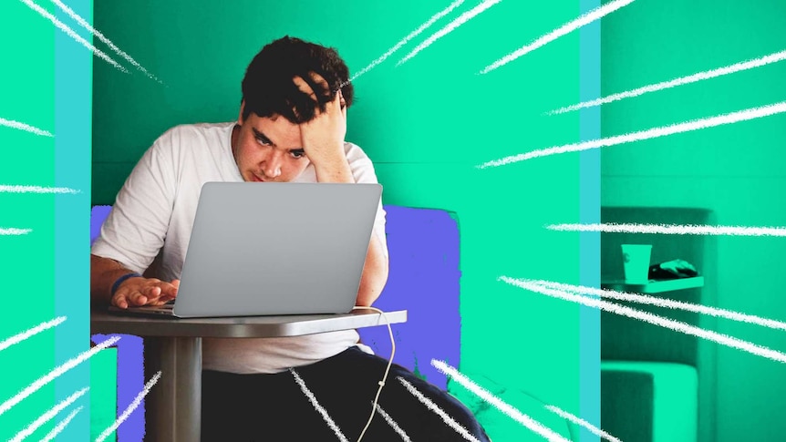 A man looks at a laptop with his head in his hands to depict dealing with a stressful time at work.