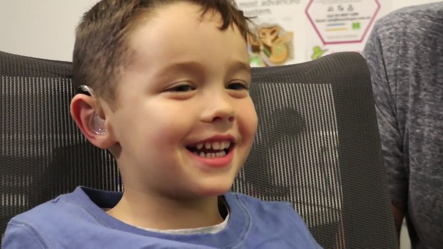 Boy wearing a hearing aid