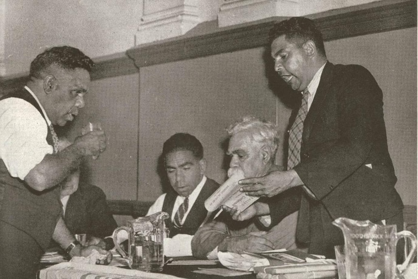 William Cooper and others reading the resolution of the Aborigines Progressive Party Association on 26 January 1938.
