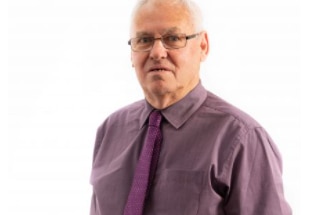 A headshot of an older man.