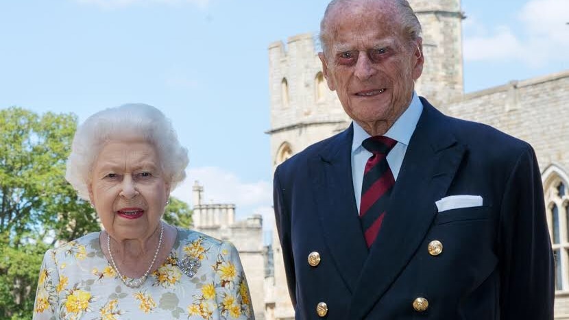A photograph of Queens Elizabeth II with her husband the Duke of Edinburgh, Prince Philip, in the quadrangle of Windsor Castle.