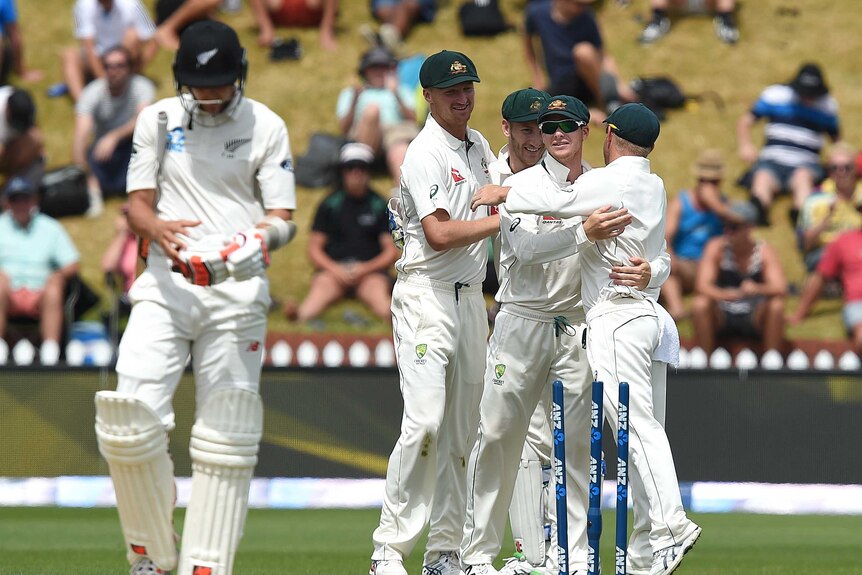Australian players celebrate following their win over New Zealand in the first Test in Wellington
