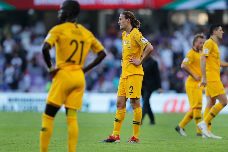 Socceroos player Jackson Irvine stands with hands on hips after defeat to Jordan in the Asian Cup