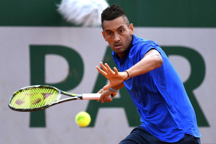 Nick Kyrgios hits a forehand against Igor Sijsling at the French Open