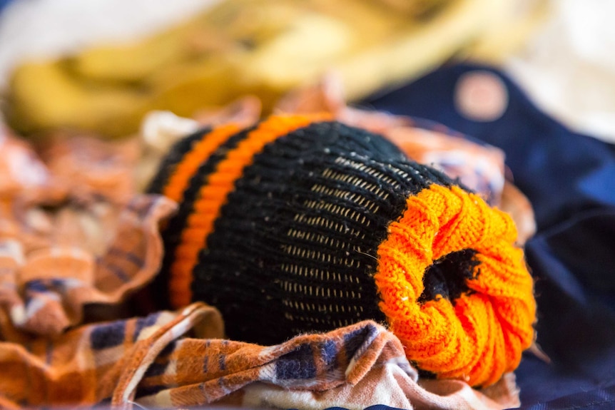 A pair of orange and black socks