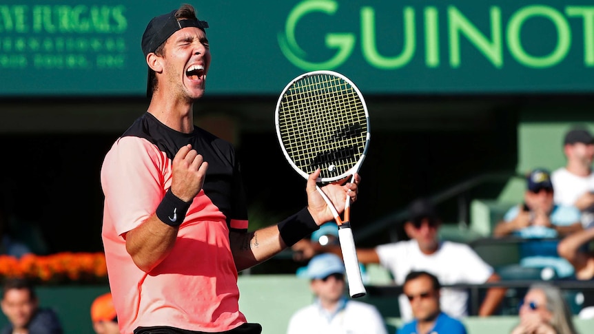 Thanasi Kokkinakis creams out after beating Roger Federer at Miami Open.