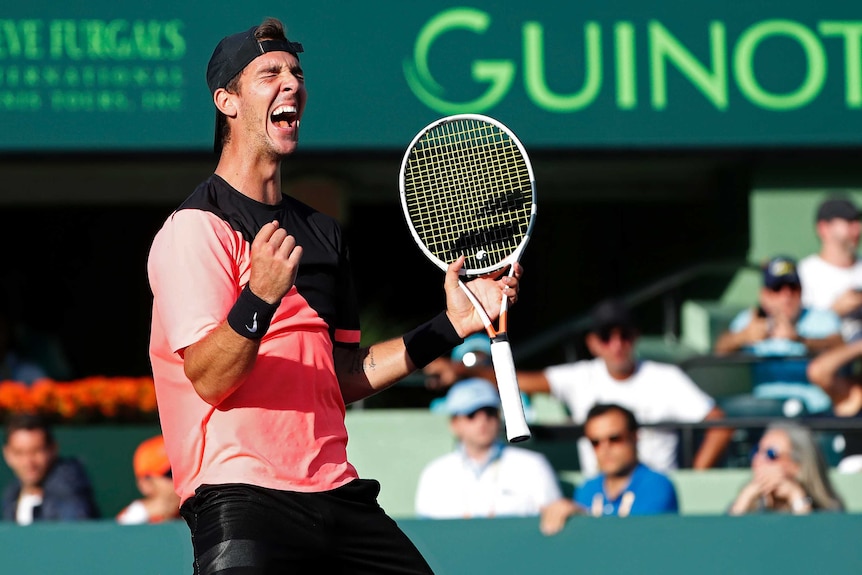 Thanasi Kokkinakis creams out after beating Roger Federer at Miami Open.
