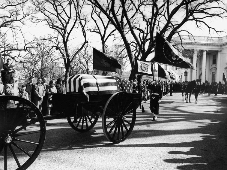 The funeral procession of JFK leaves the White House.