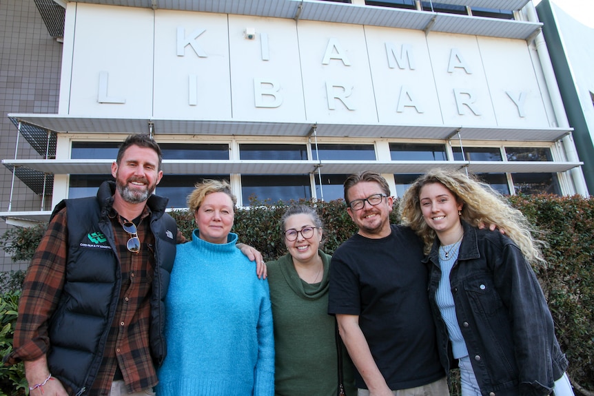 Five people stand in front of Kiama Library