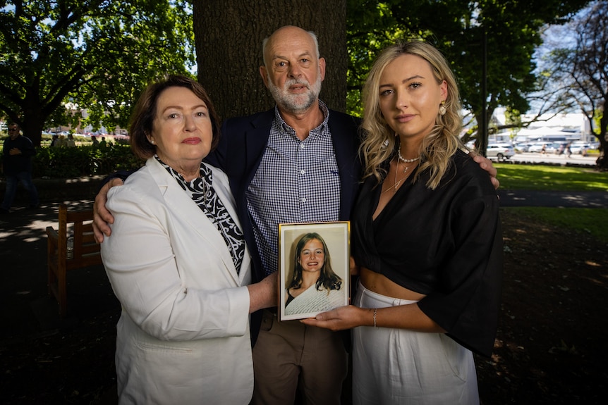Anne, Craig and Amanda Duncan with a photo of Zoe Duncan.