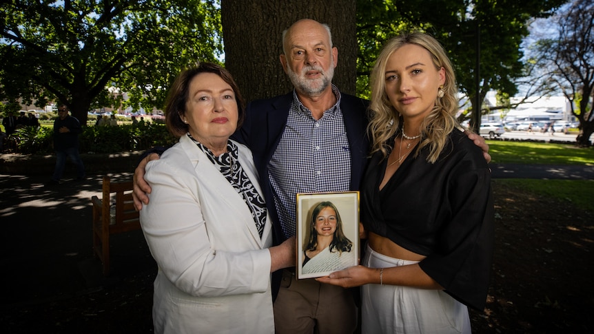 Anne, Craig and Amanda Duncan with a photo of Zoe Duncan.