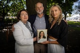 Anne, Craig and Amanda Duncan with a photo of Zoe Duncan.