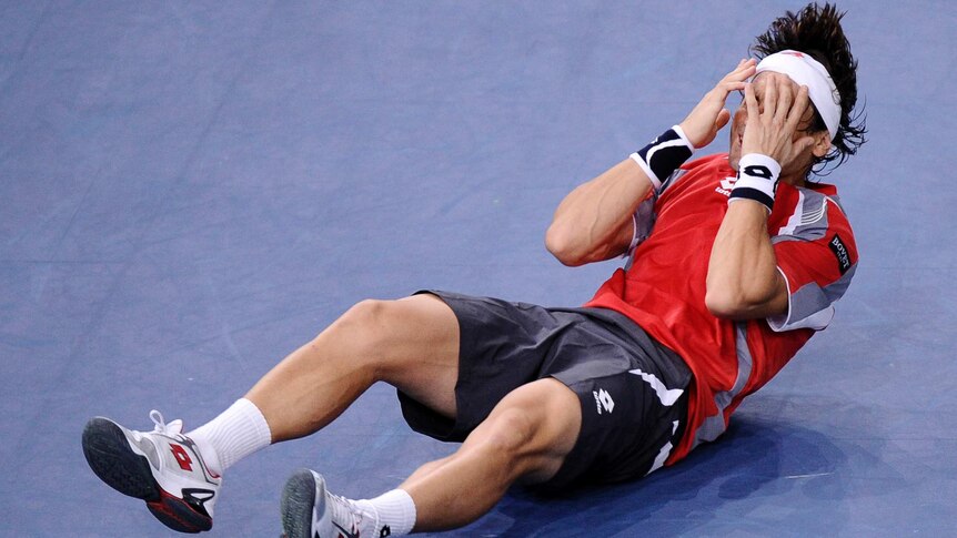 Finally ... David Ferrer celebrates his first Masters title triumph in Paris.