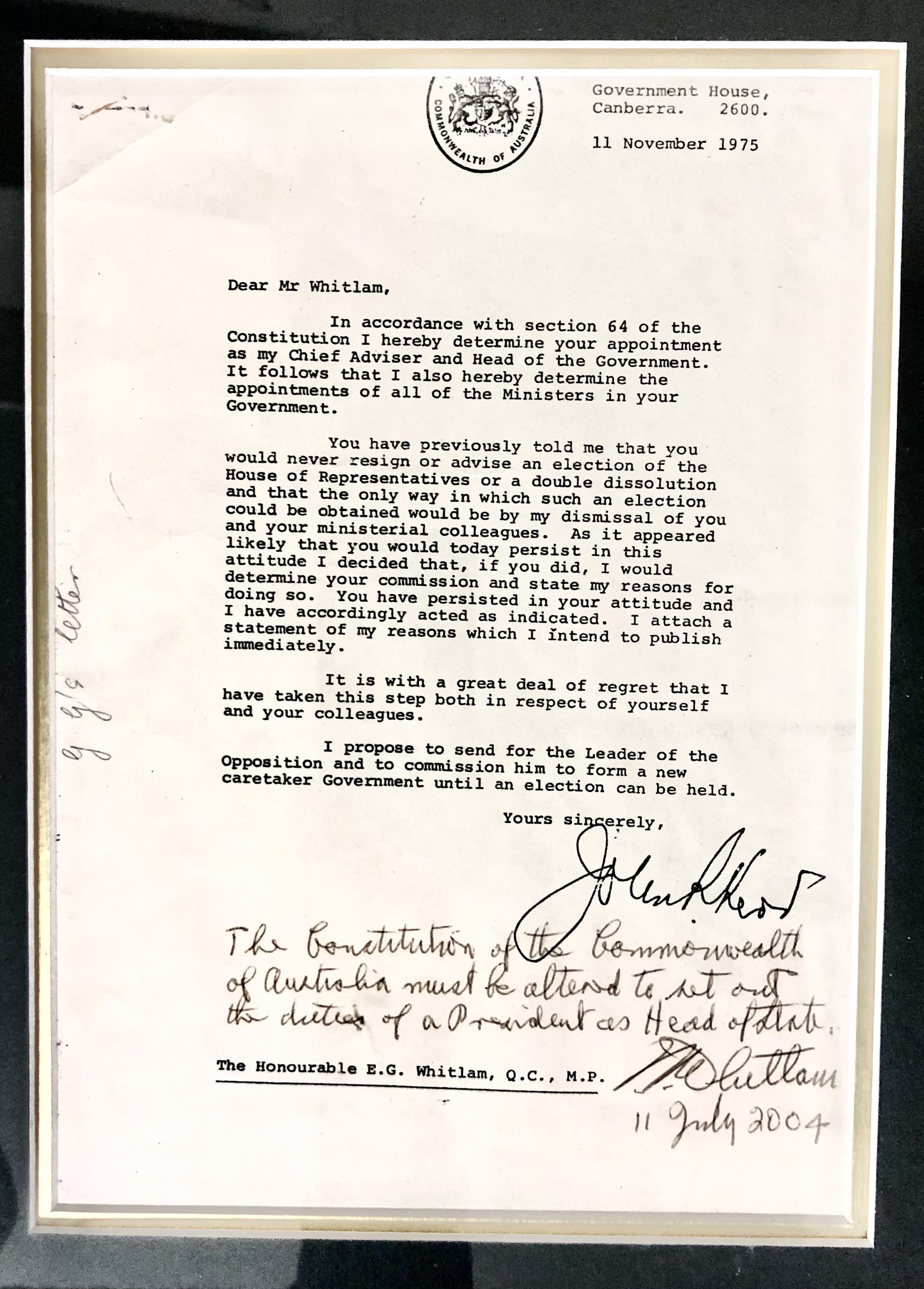 A photo of Sir John Kerr's dismissal letter addressed to Gough Whitlam in a glass cabinet. Whitlam has graffitied over the top.