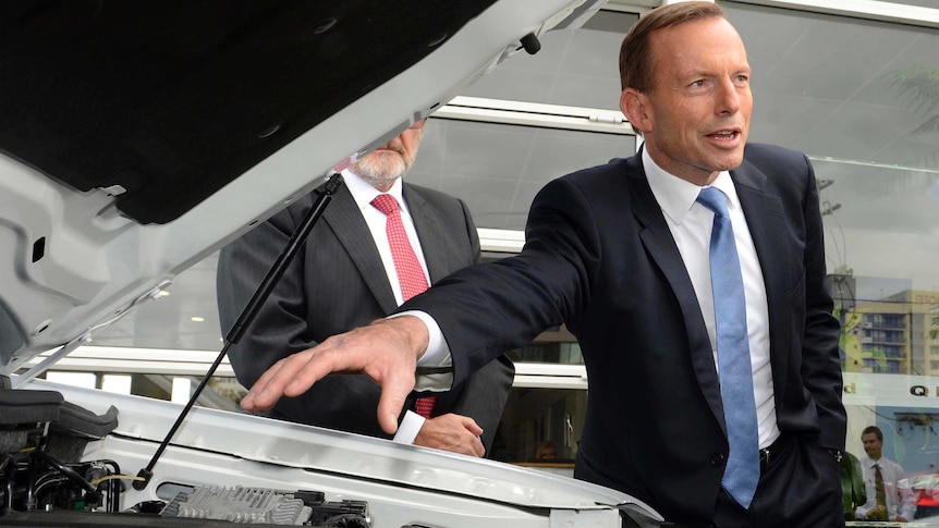 Tony Abbott visits a Ford car dealership in Springwood