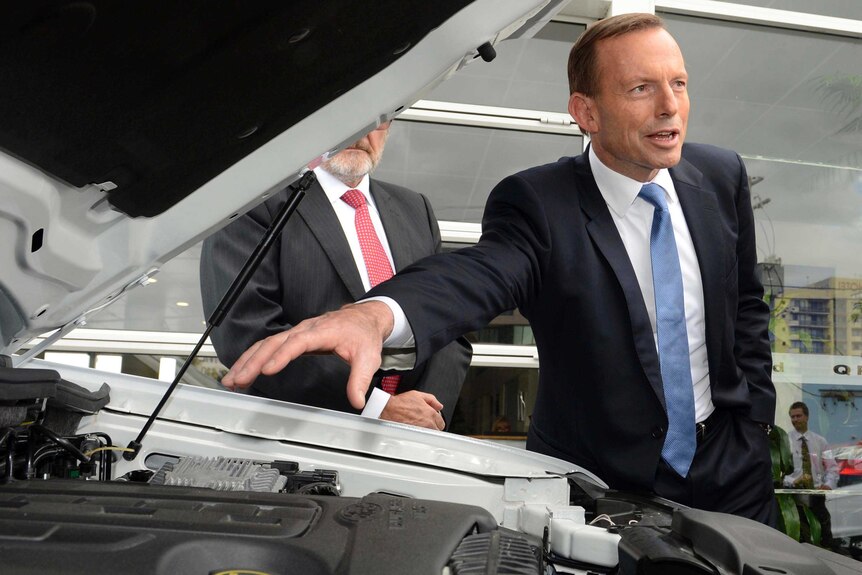 Tony Abbott visits a Ford car dealership in Springwood