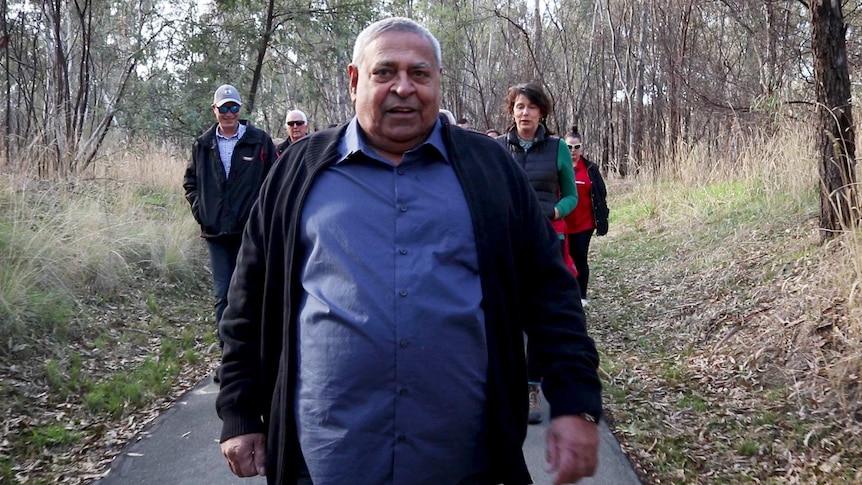 Local elder Uncle Ruben Baksh leads locals on a special walk through 'The Flats' between Shepparton and Mooroopna