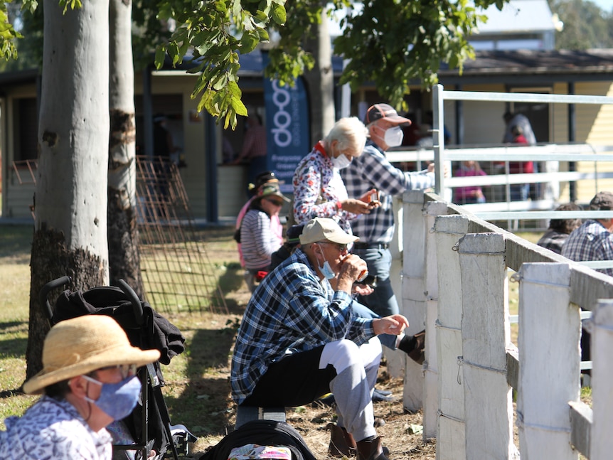 Spectators wearing masks at the Rappville Sports Ground.