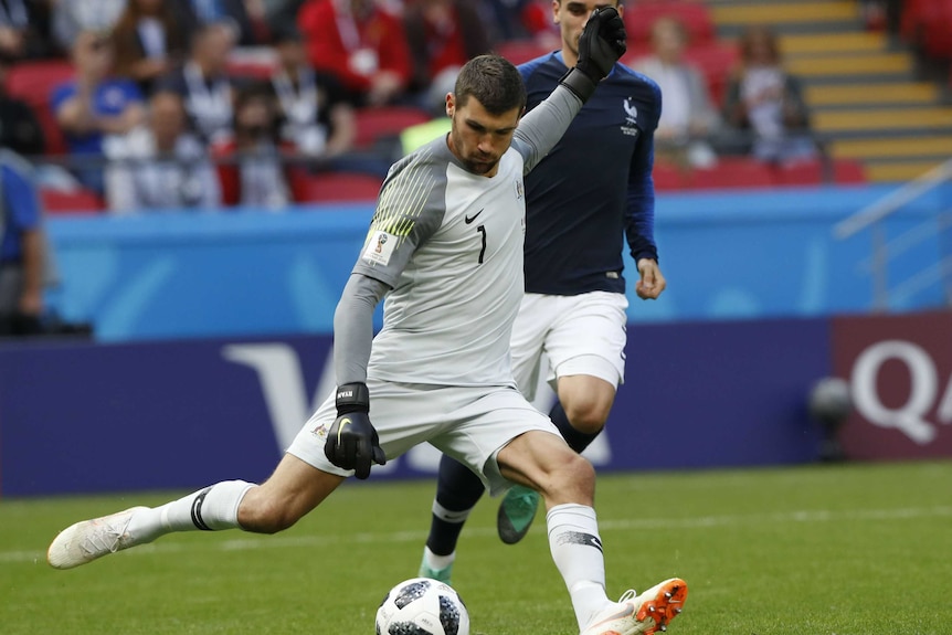 Australian goalkeeper Mat Ryan kicks the ball