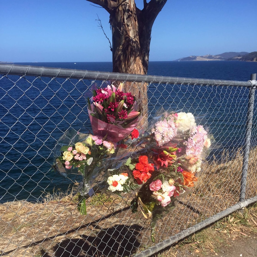 Floral tributes at the clifftop where a 17 year old fell to her death January 29, 2017