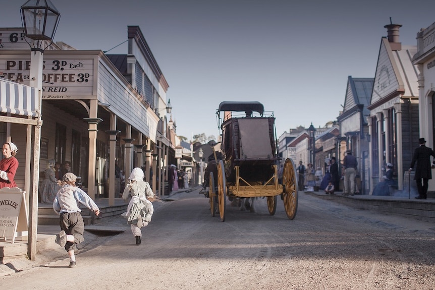 Children chase the old Coach at Sovereign Hill
