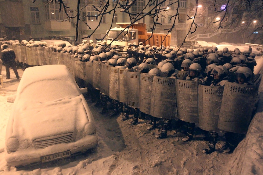 Interior Ministry personnel block a street in Kiev.