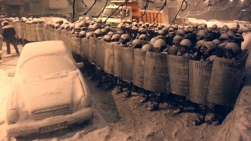 Interior Ministry personnel block a street in Kiev.