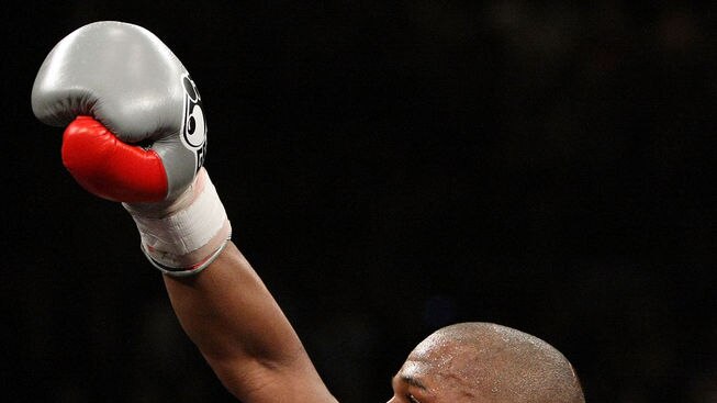 Still undefeated... Mayweather retained his WBC world welterweight title with a 10th-round knockdown.