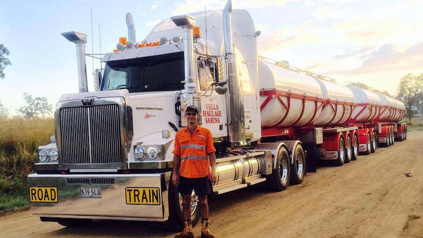 George Vella stands in front of one of  his trucks from Vella Haulage Sarina  in central Queensland, date unknown.