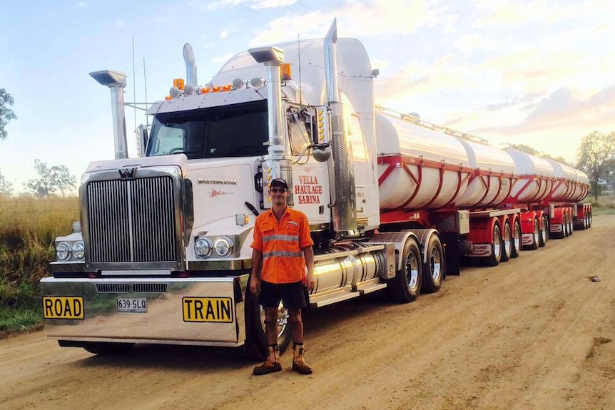 George Vella stands in front of one of  his trucks from Vella Haulage Sarina  in central Queensland, date unknown.