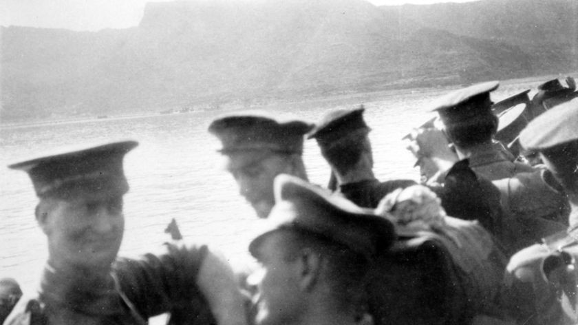 Gallipoli Peninsula, Turkey, 25 April 1915. Photography taken from a Destroyer standing offshore at Anzac Cove, waiting to transfer troops of the 1st Battalion AIF to rowing boards in which they were towed ashore by steam boats. In the background is Plugge's Plateau. This group of soldiers landed below its southern edge.