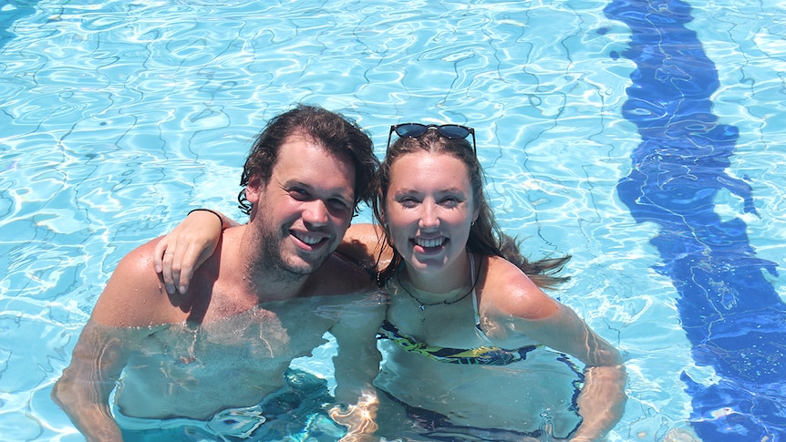A man and a woman in a pool