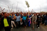 Workers take part in a march at Lonmin's Marikana mine in South Africa