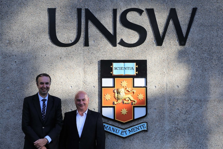 Two men in front of the UNSW science building