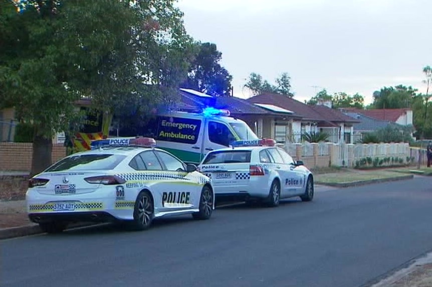 Police and ambulance vehicles in Afford Street.