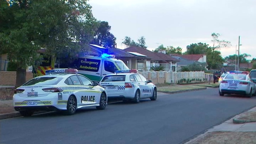 Police and ambulance vehicles in Afford Street.