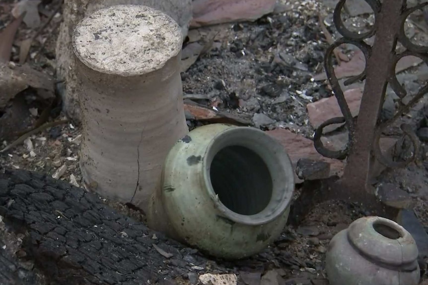 Pottery pieces on a burnt-out ground.