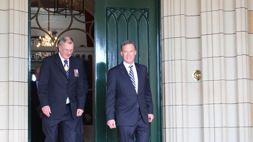 Premier Will Hodgman emerges from Government House with Governor Peter Underwood.