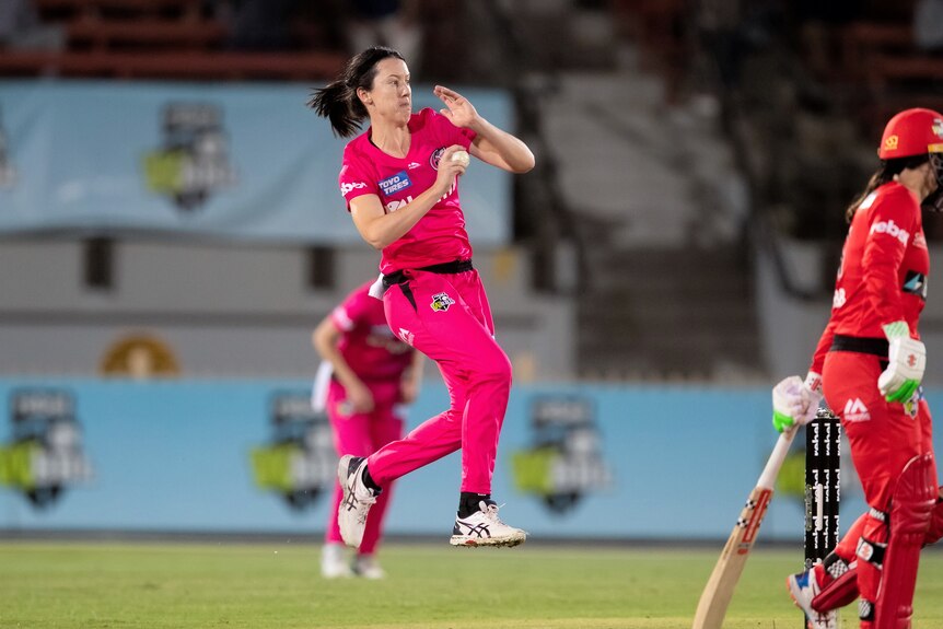 Stella Campbell leaps in the air as she prepares to bowl.