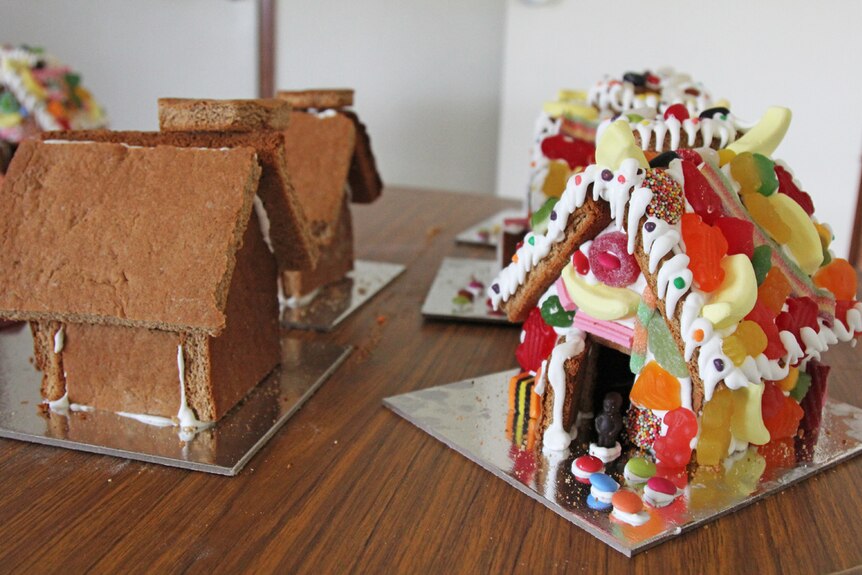Colourful gingerbread houses dripping in lollies and icing sugar