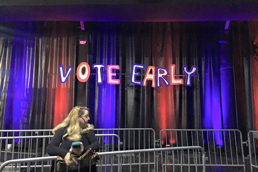 "vote early" written in big, blue and red bubble letters on a flag