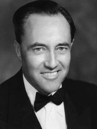 A black-and-white archive portrait photo of David Goodall in a suit and bowtie.